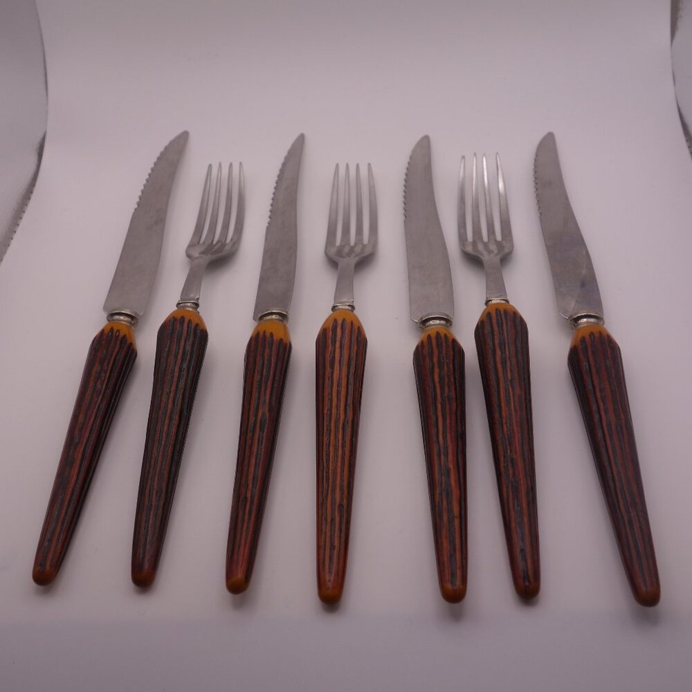Three(3) Faux Bone Handle Forks and Four(4) Faux Bone Handle Steak Knives